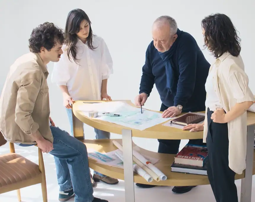 1. People collaborating on architectural plans at Studio 9 in Georgia.
