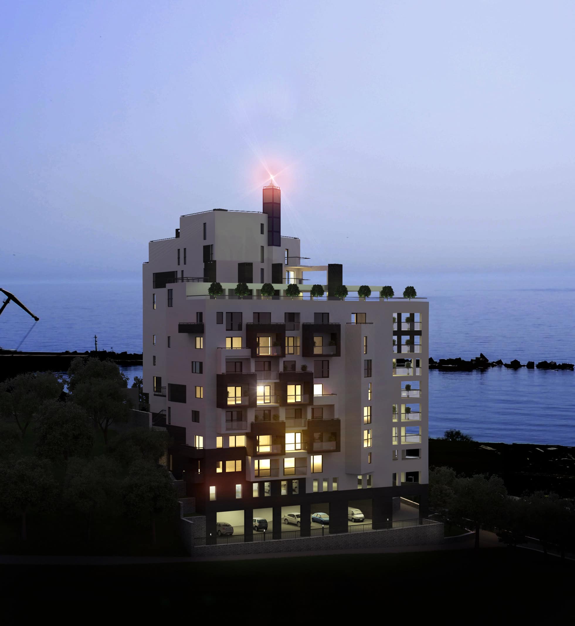 Modern multi-story residential building near the sea with illuminated apartments at dusk.