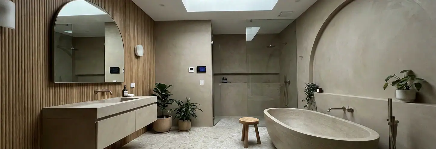 Contemporary bathroom with beige tones, modern fixtures, and minimalist design at Studio 9.