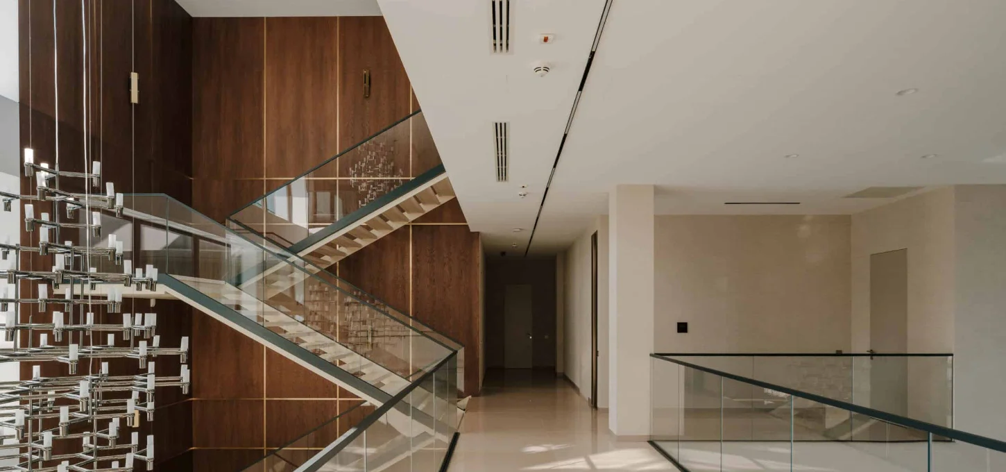 Interior lobby of Studio 9 with contemporary design and elegant wooden accents.