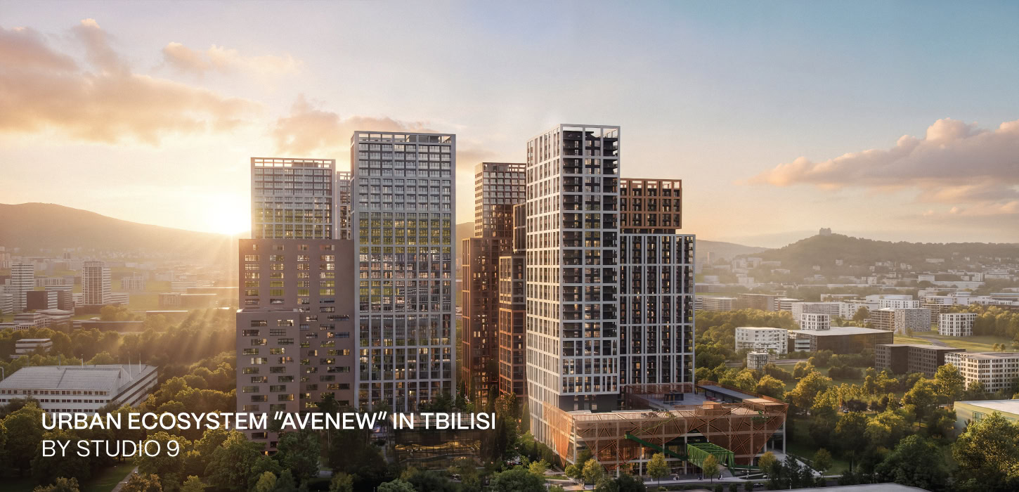Modern high-rise buildings in Tbilisi with sunset background.
